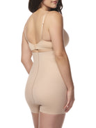 a woman wearing a beige high waisted tummy control boyshort shapewear
