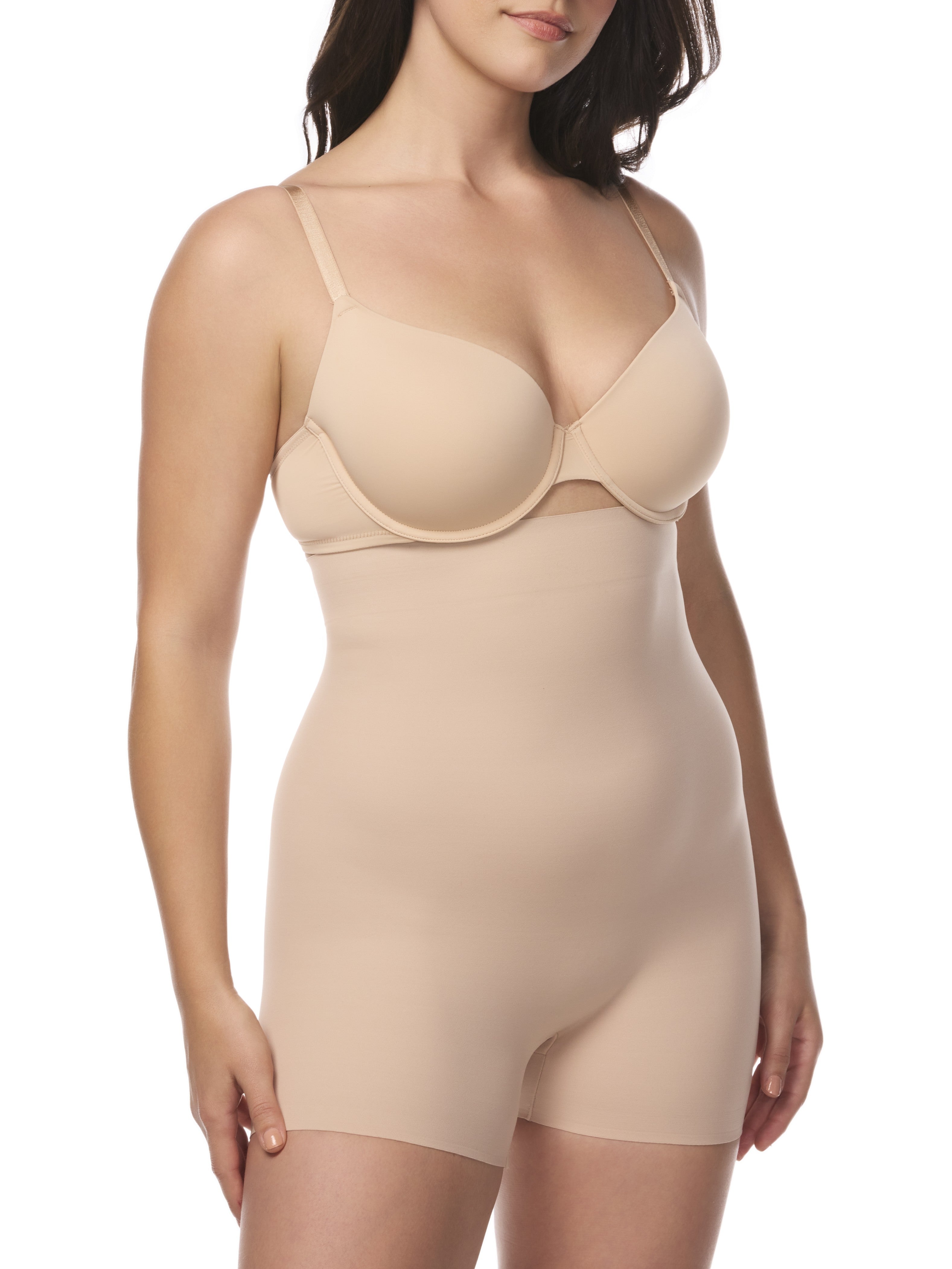 a woman wearing a beige high waisted tummy control boyshort shapewear