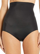 a woman wearing black high waisted tummy control underwear