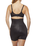 a woman wearing a black high waisted tummy control shapewear short