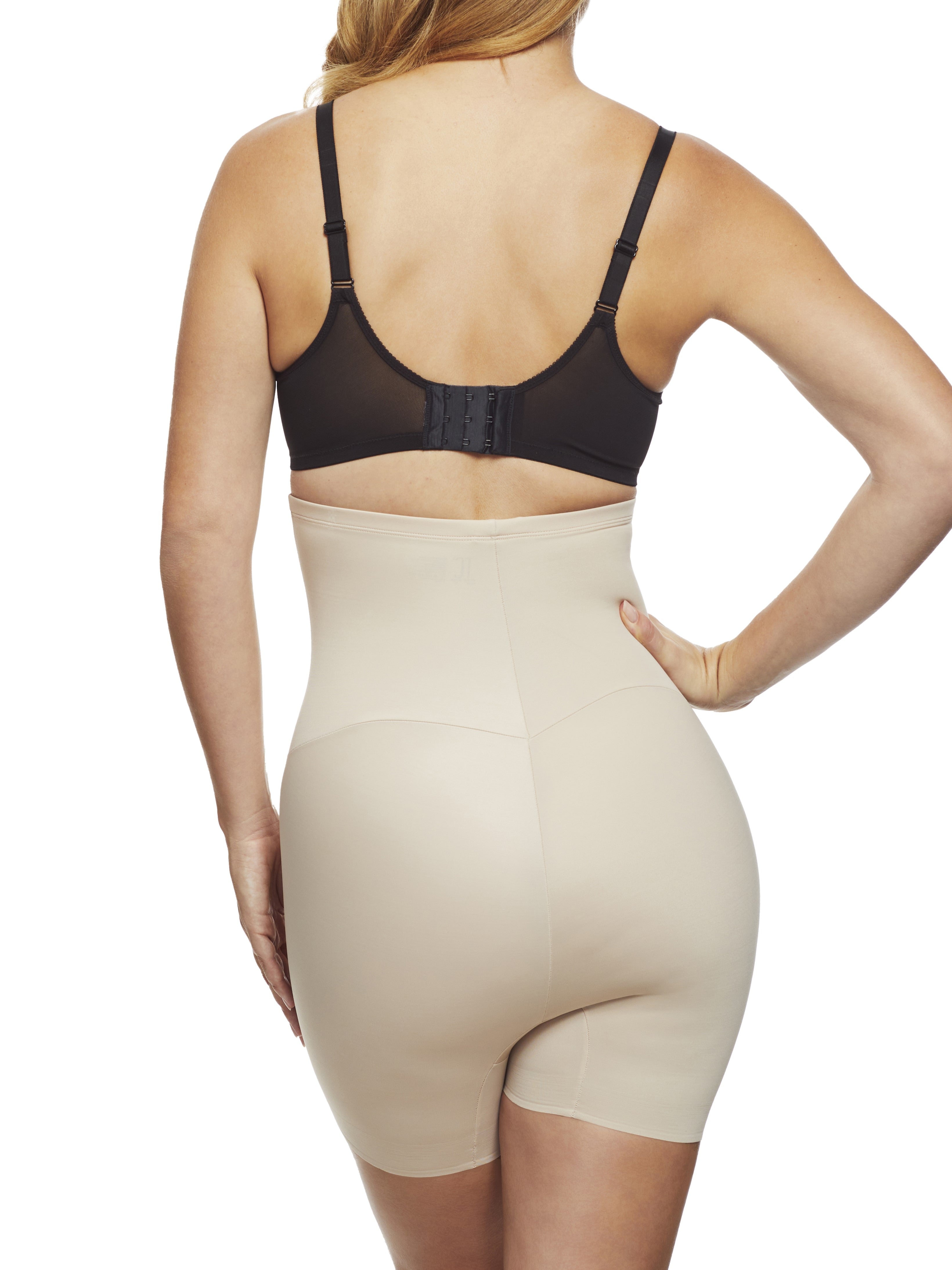 a woman wearing a nude high waisted tummy control shapewear short