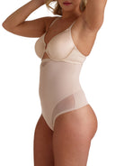 a woman wearing a beige shaping thong 