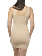 Beige slip shapewear worn by a model on a white background