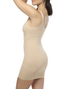 Beige slip shapewear worn by a model on a white background