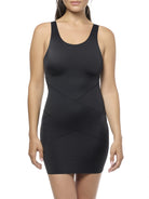 Black slip shapewear worn by a model on a white background