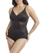 a woman wearing a black tummy control body shaper shapewear