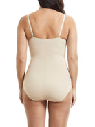 a woman wearing a nude tummy control body shaper shapewear