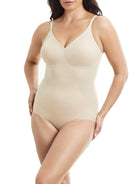 a woman wearing a beige shaping bodysuit