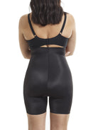 a woman wearing black high waisted tummy control shapewear shorts