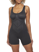 a woman wearing a black tummy control shapewear bodysuit