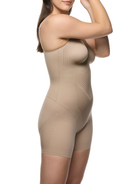 a woman wearing a black tummy control shapewear bodysuit body shaper