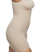 a close-up detail of a woman wearing a nude tummy control shapewear bodysuit