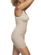 a woman wearing a nude tummy control shapewear bodysuit