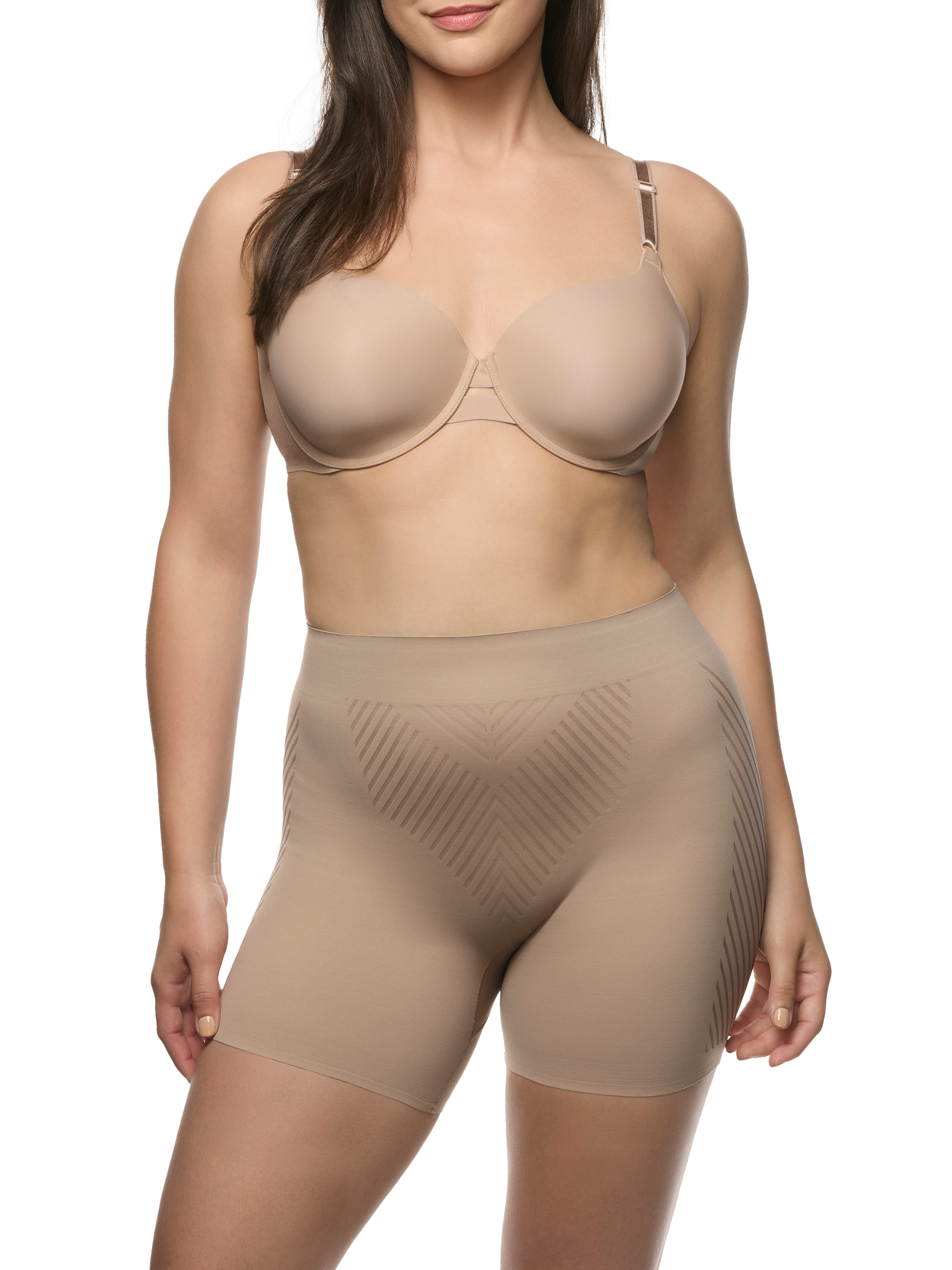 a woman wearing a beige tummy control shapewear short