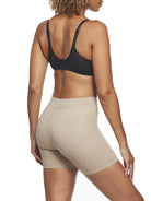 a woman wearing a nude tummy control shapewear short