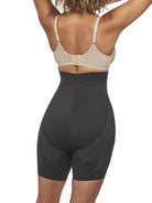 a woman wearing a black high waisted tummy control shapewear short