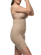 a woman wearing a beige high waisted tummy control shapewear short