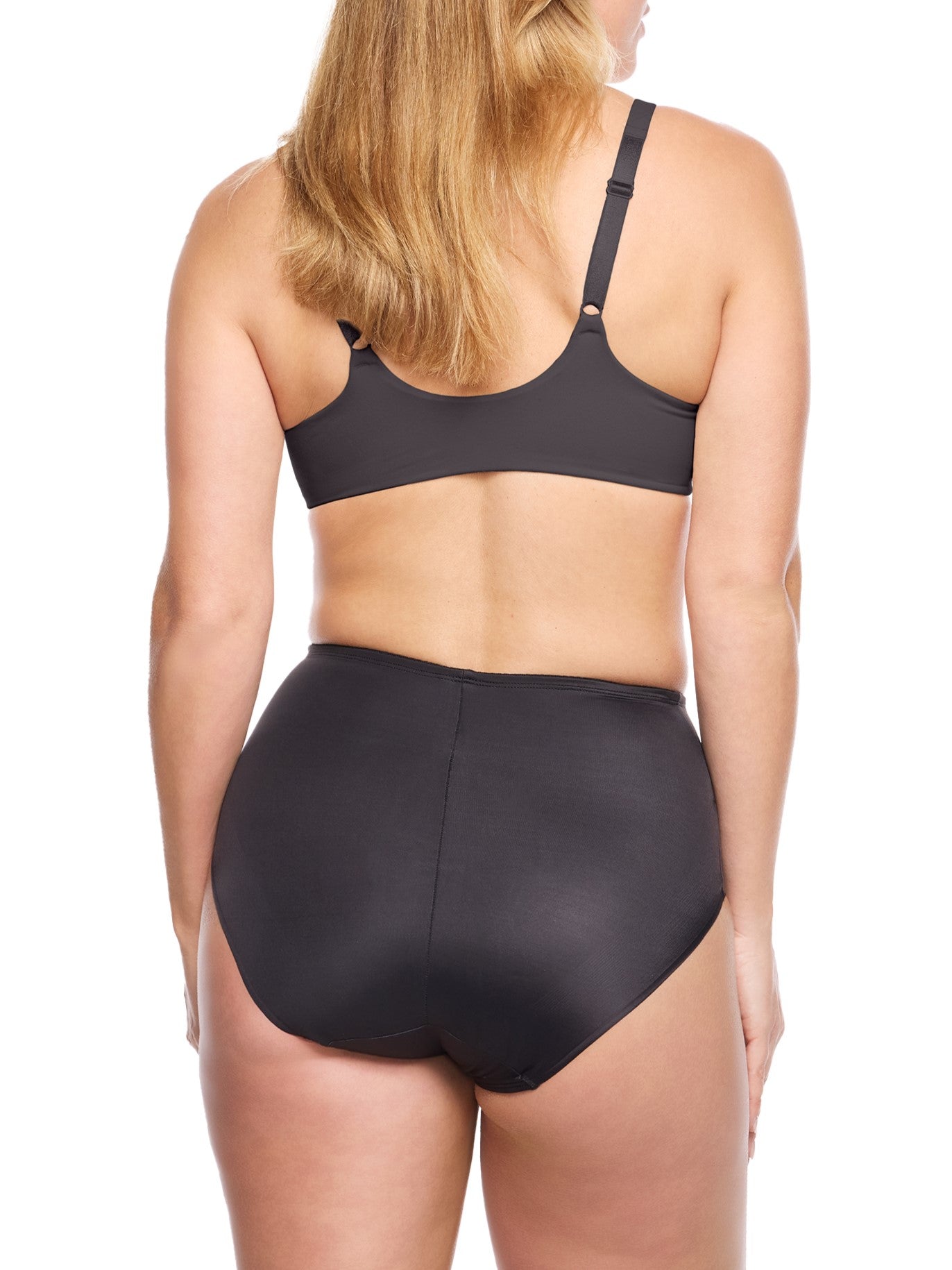 a woman wearing black tummy control underwear