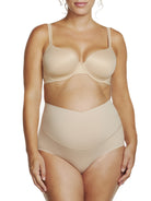 a woman wearing a beige maternity support brief