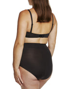 a woman wearing a black maternity support brief