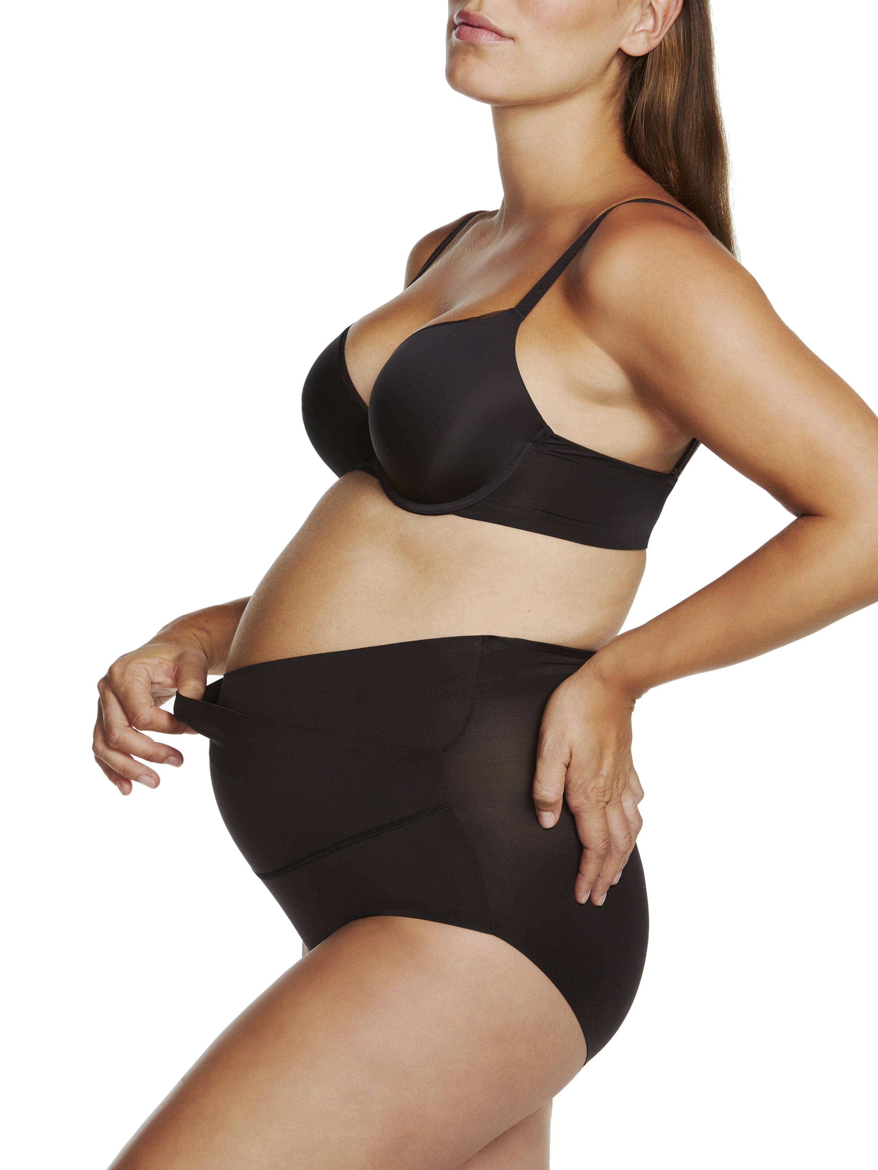 a woman wearing a black maternity support brief