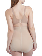 a woman wearing a nude maternity shapewear support brief