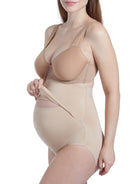 a woman wearing a nude maternity shapewear support brief