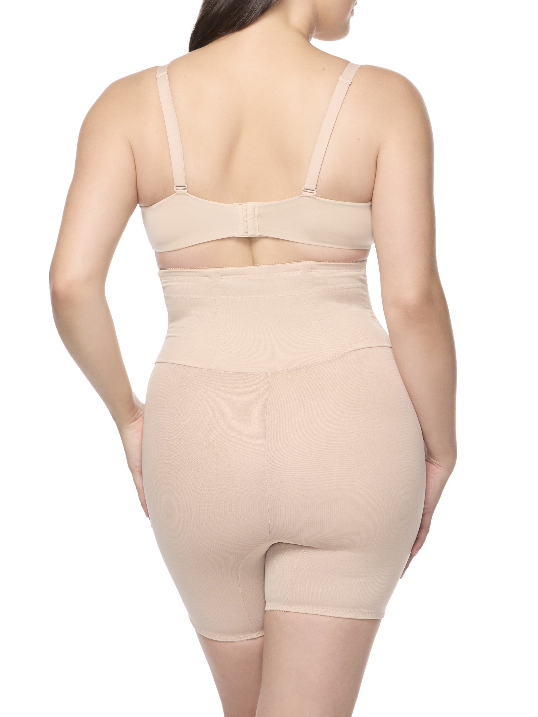 a woman wearing a nude high waisted tummy control waist cincher shaping short shapewear