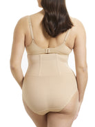 a woman wearing nude high waisted tummy control waist cincher waist trainer underwear shapewear