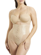 a woman wearing a beige shaping brief