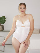 a woman wearing a white high waisted tummy control brief waist cincher waist trainer body shaper