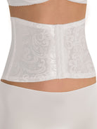 a woman wearing a white waist cincher