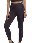 a woman wearing black tummy control leggings shapewear