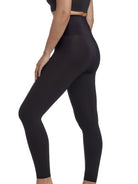 a woman wearing black tummy control leggings shapewear