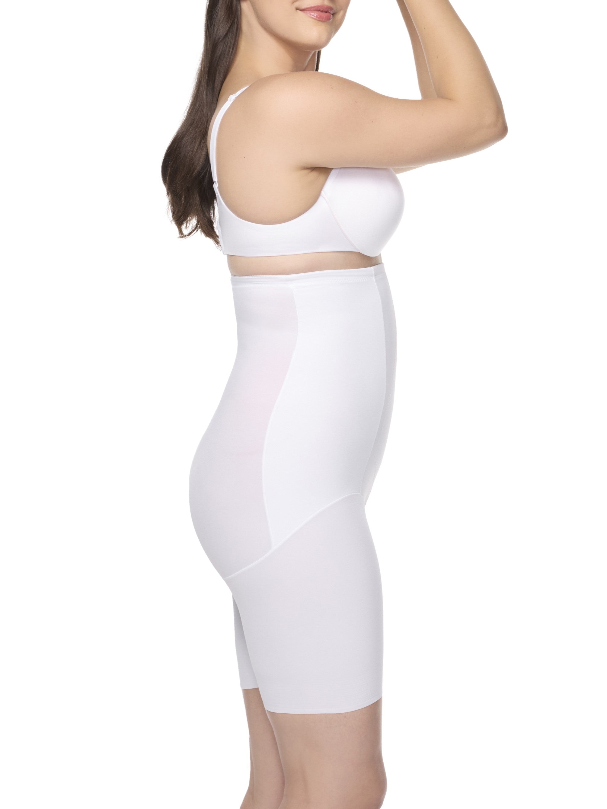 a woman wearing white high waisted tummy control shapewear shorts