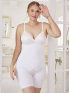 a woman wearing a white high waisted thigh slimmer shapewear short in a bathroom all-groups