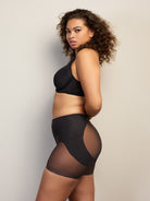 a woman wearing a black butt lift tummy control shapewear short all-groups