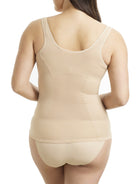 a woman wearing a nude open bust shaping camisole shapewear