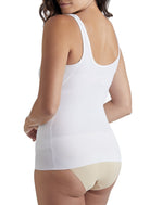 a woman wearing a white shaping camisole tank top shapewear