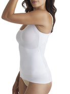 a woman wearing a white shaping camisole tank top shapewear