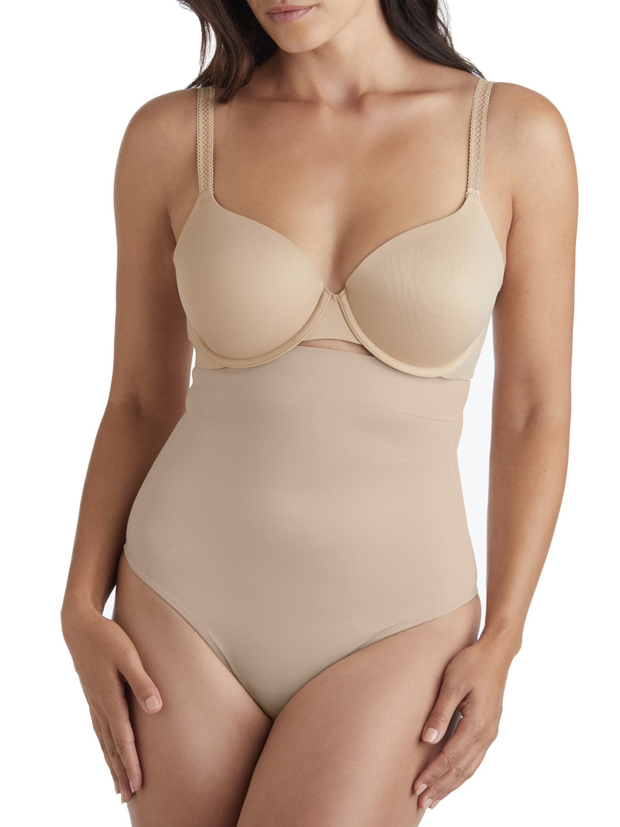 a woman wearing a beige shaping brief