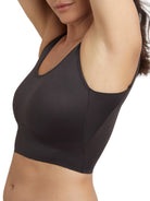 a woman wearing a black shaping bralette