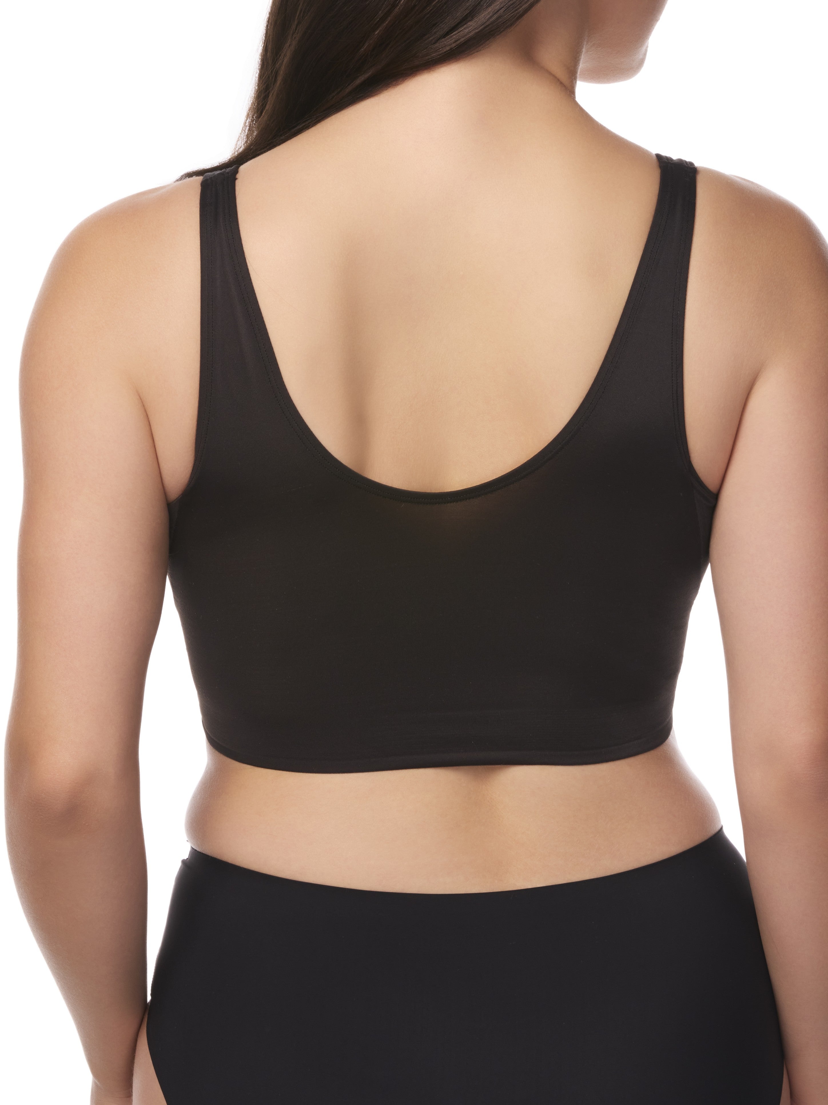 a woman wearing a black underarm smoothing bralette
