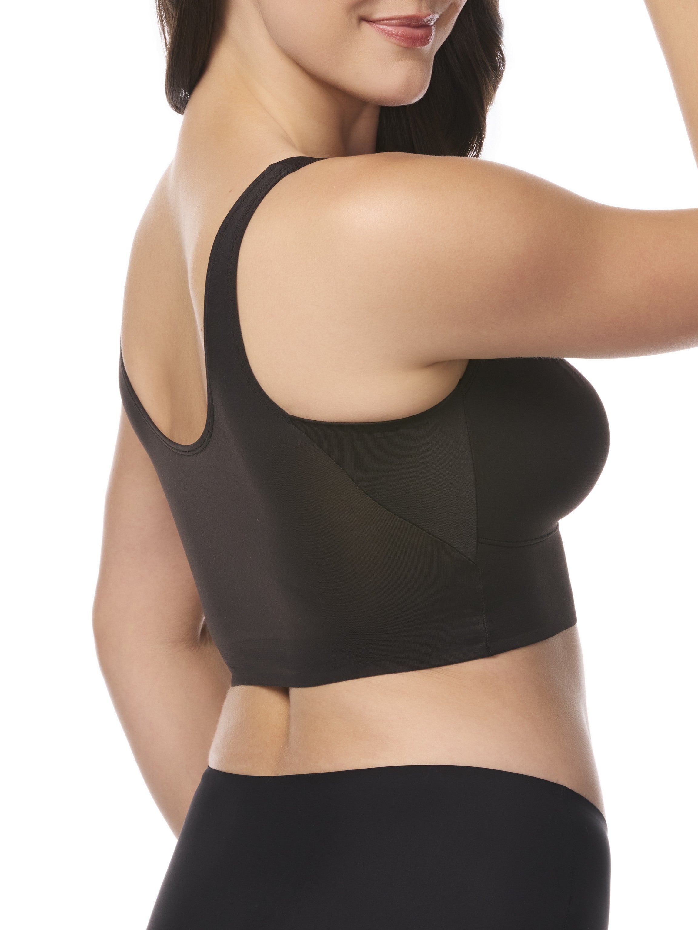 a woman wearing a black underarm smoothing bralette