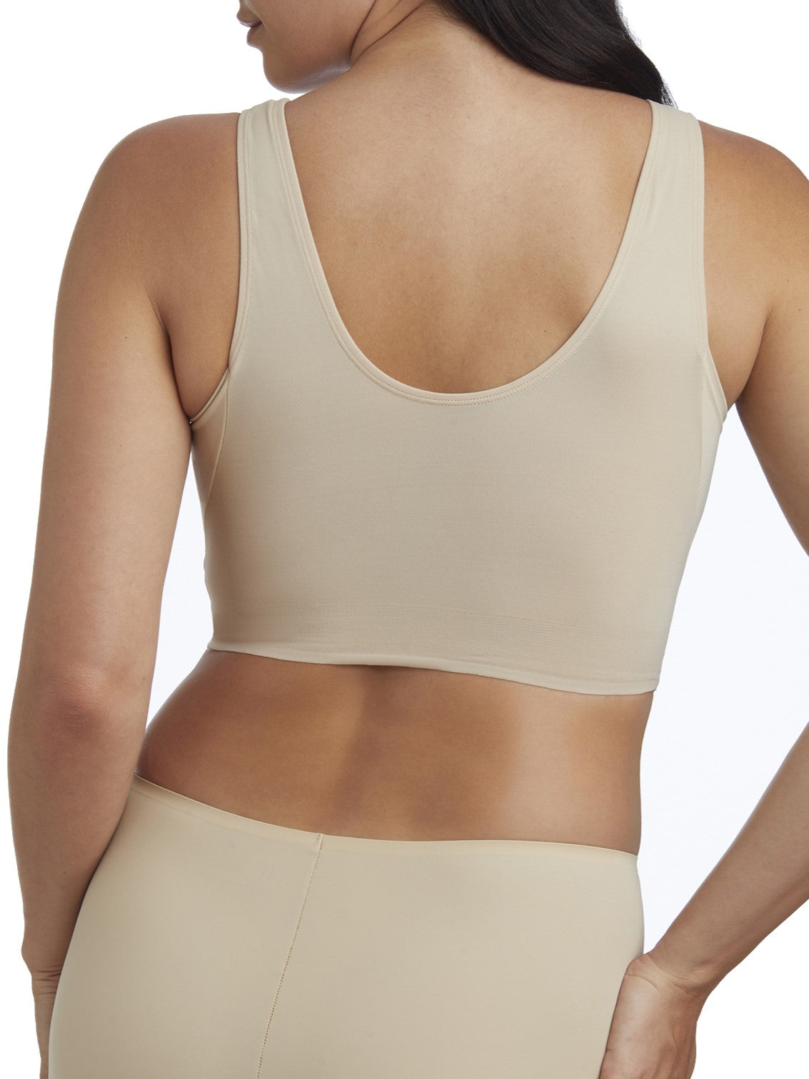 a woman wearing a beige shaping lounge bra