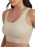 a woman wearing a beige shaping lounge bra