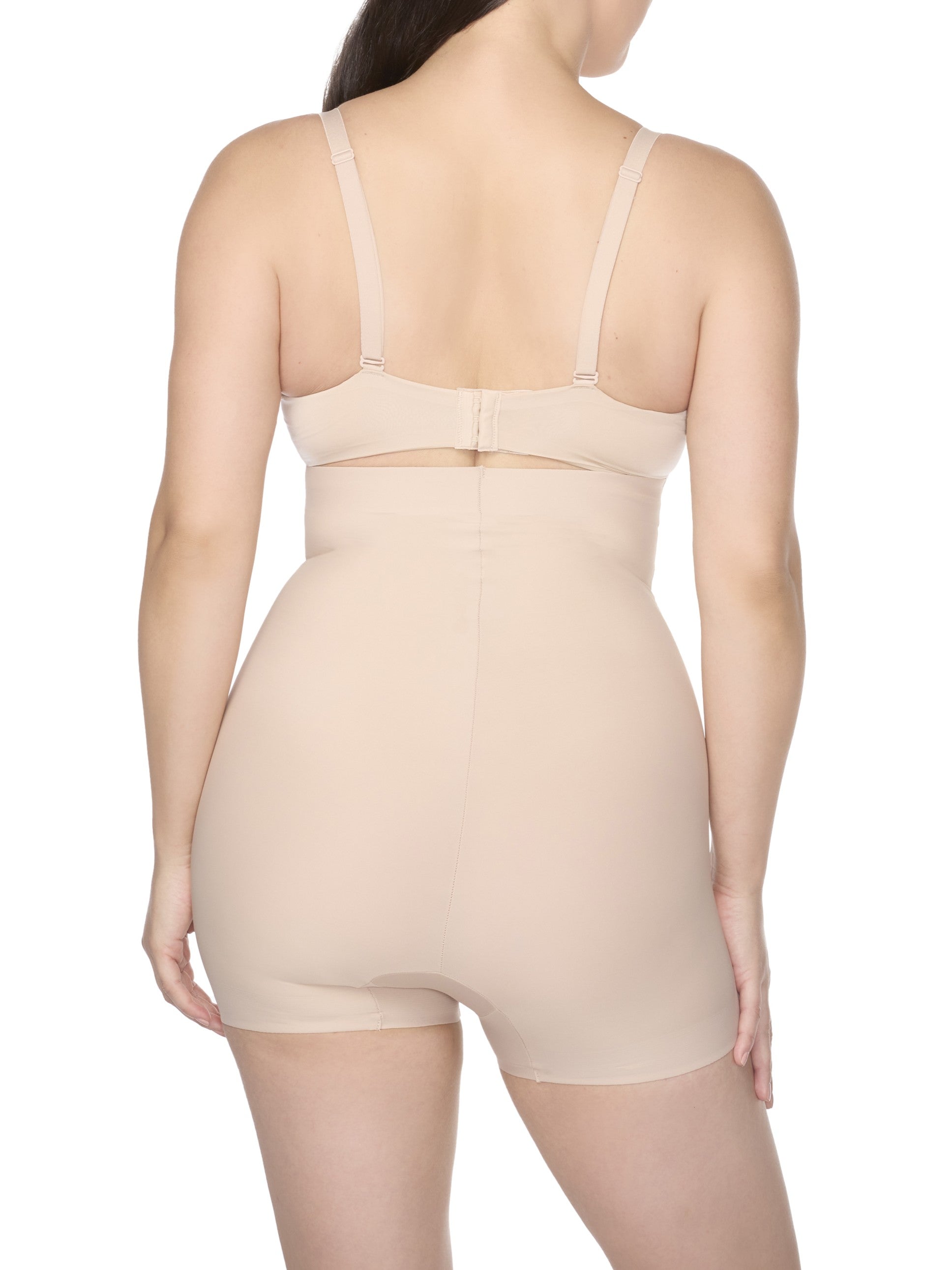 a woman wearing a nude high waisted tummy control shapewear short