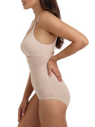 a woman wearing a beige high-waist shaping brief