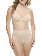 A woman in a beige padded shaping brief on a white background