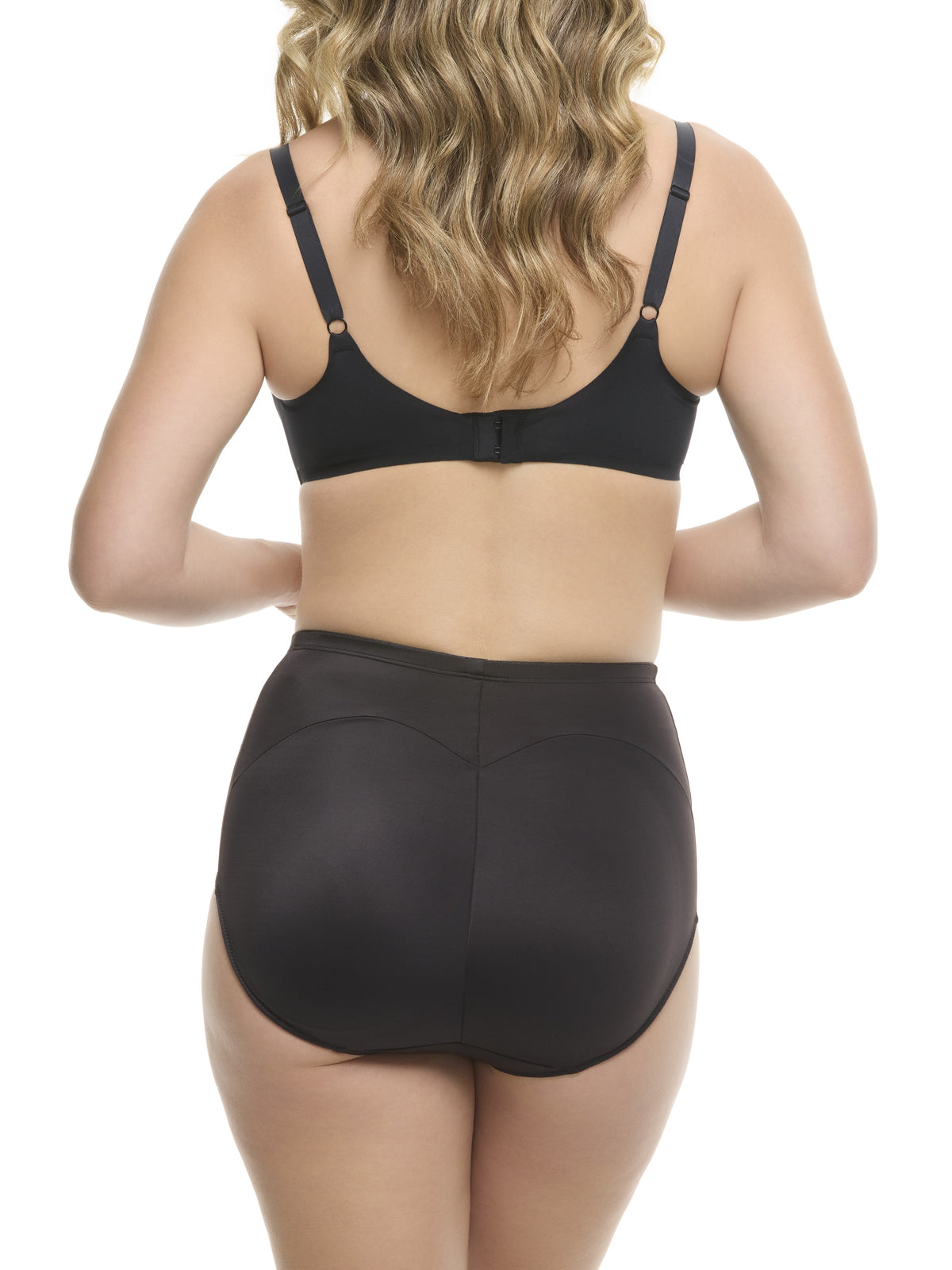 A woman in a beige padded shaping brief on a white background